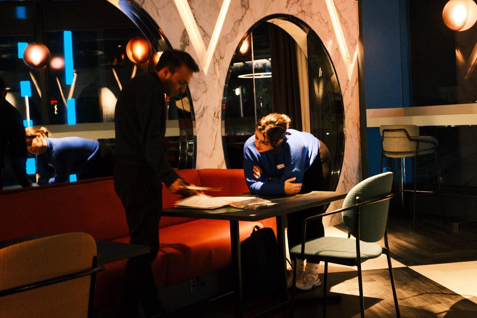 Two people looking over a table at Vega